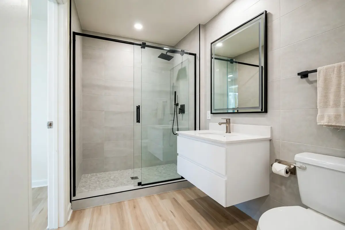 Tub-to-shower conversion: dated tub combo replaced with a walk-in shower
